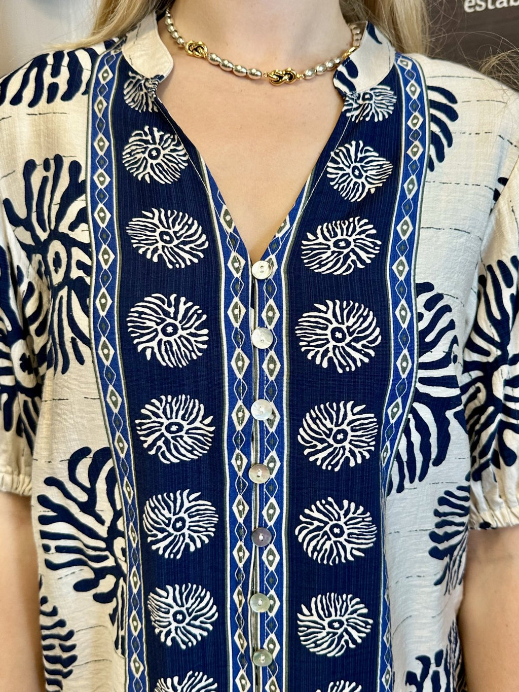 Mary Top featuring a stylish abstract print design with puff sleeves and button front detail at Raggdoll Boutique.