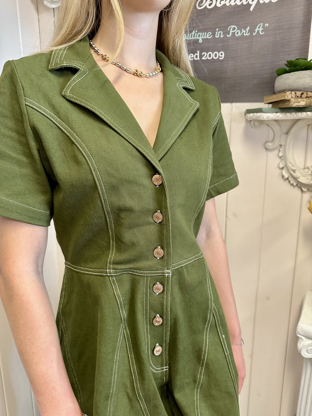 Taylor Romper - Olive short sleeve jumpsuit with contrast stitching and button front from Raggdoll Boutique.