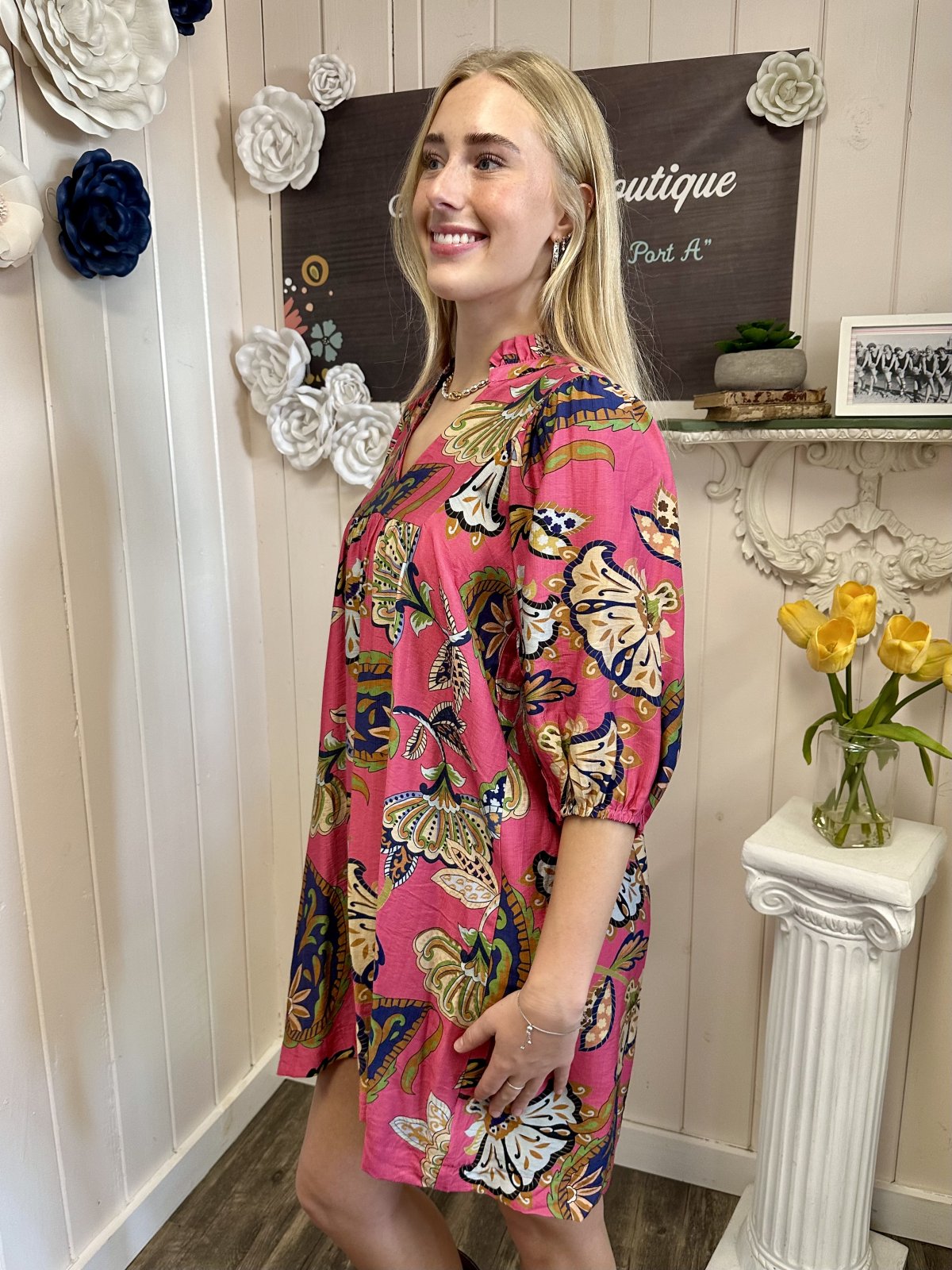 Pamela Dress from Raggdoll Boutique, featuring a pink abstract print babydoll style for trendy coastal fashion.