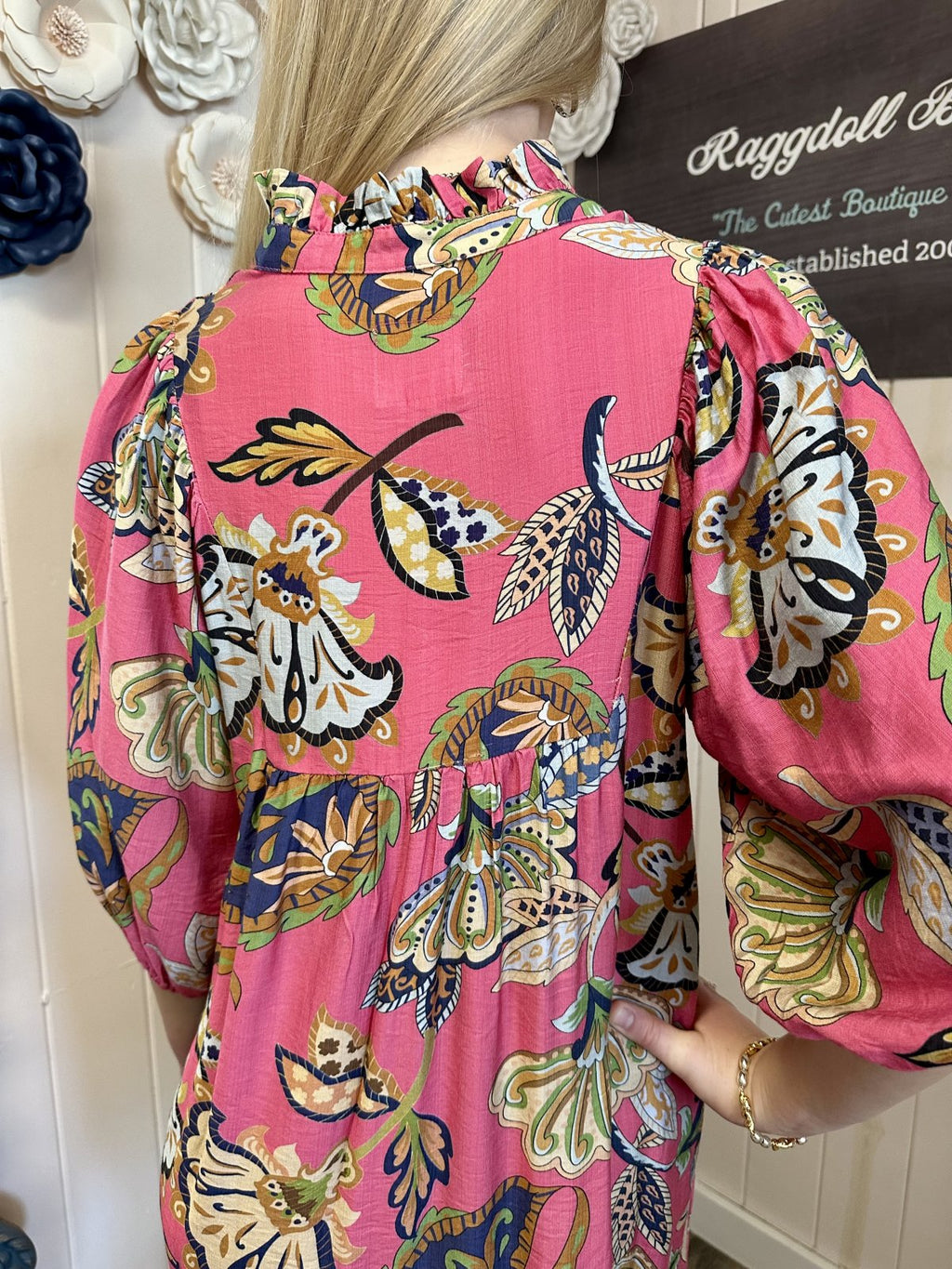 Pamela Dress in pink abstract print with puff sleeves featured at Raggdoll Boutique, perfect for coastal fashion.