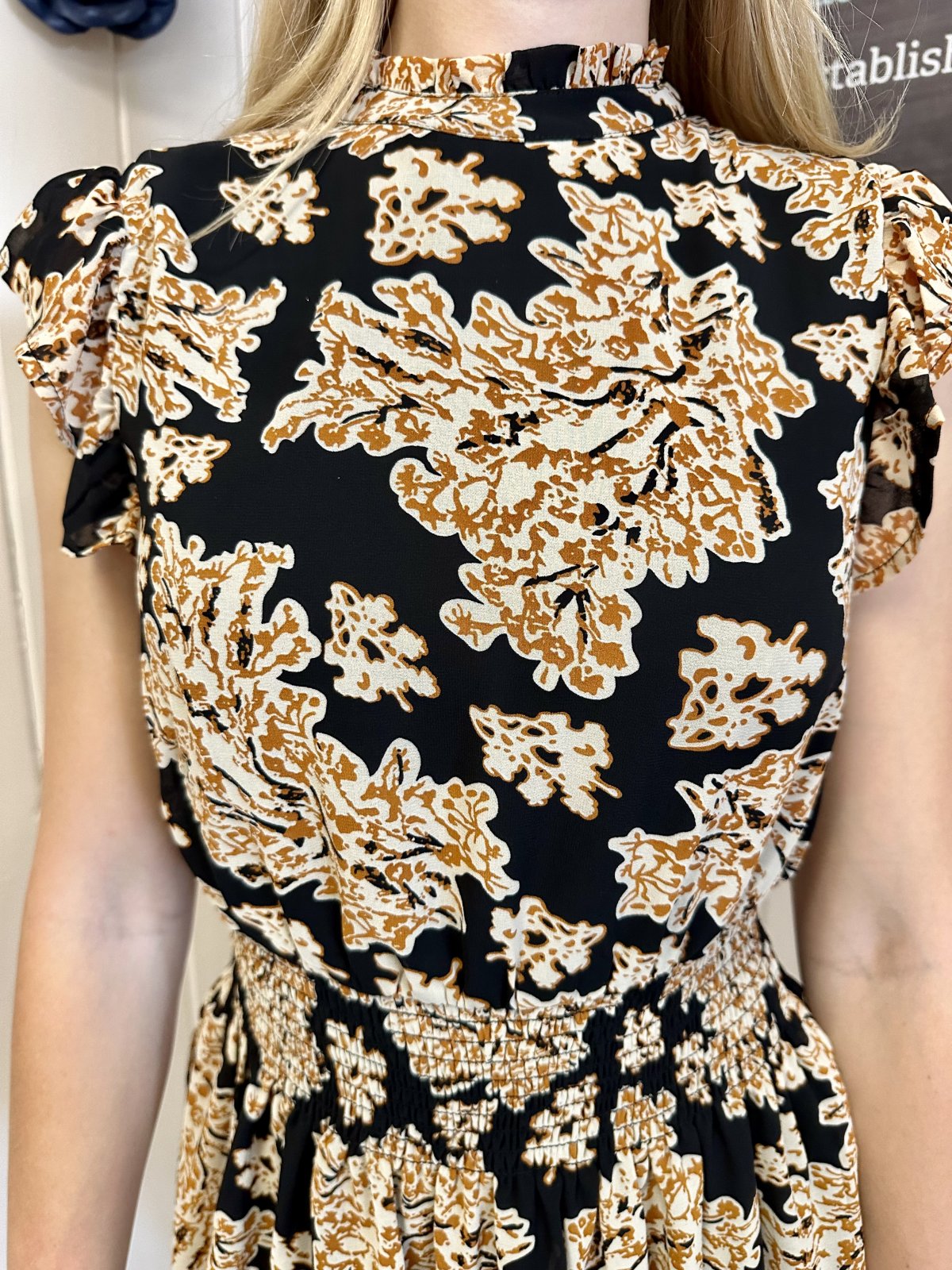 Barrett Dress detail showing black print and smocked waist, perfect for summer outfits Texas at Raggdoll Boutique.
