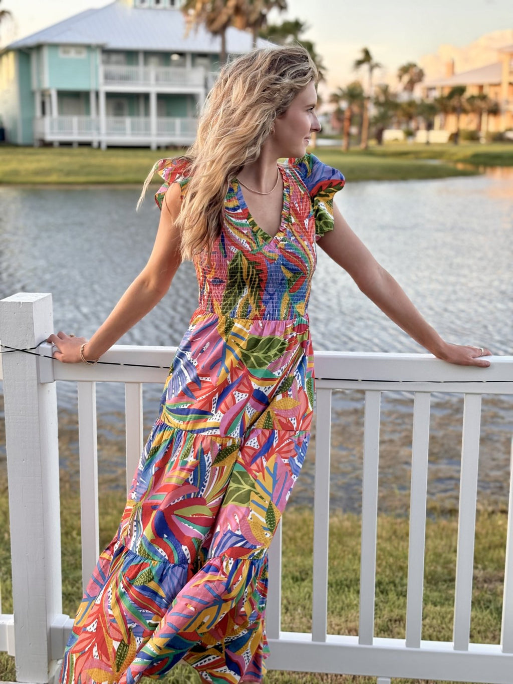 Giselle Dress in vibrant floral print, perfect for beach outings and brunch dates, from a coastal boutique clothing collection.