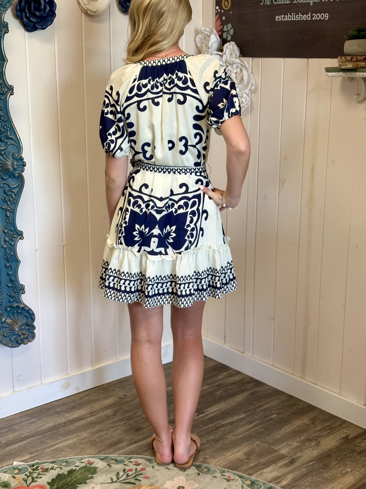 Ivory and navy border print shift dress perfect for coastal boutiques, featuring a relaxed fit ideal for beach outings.