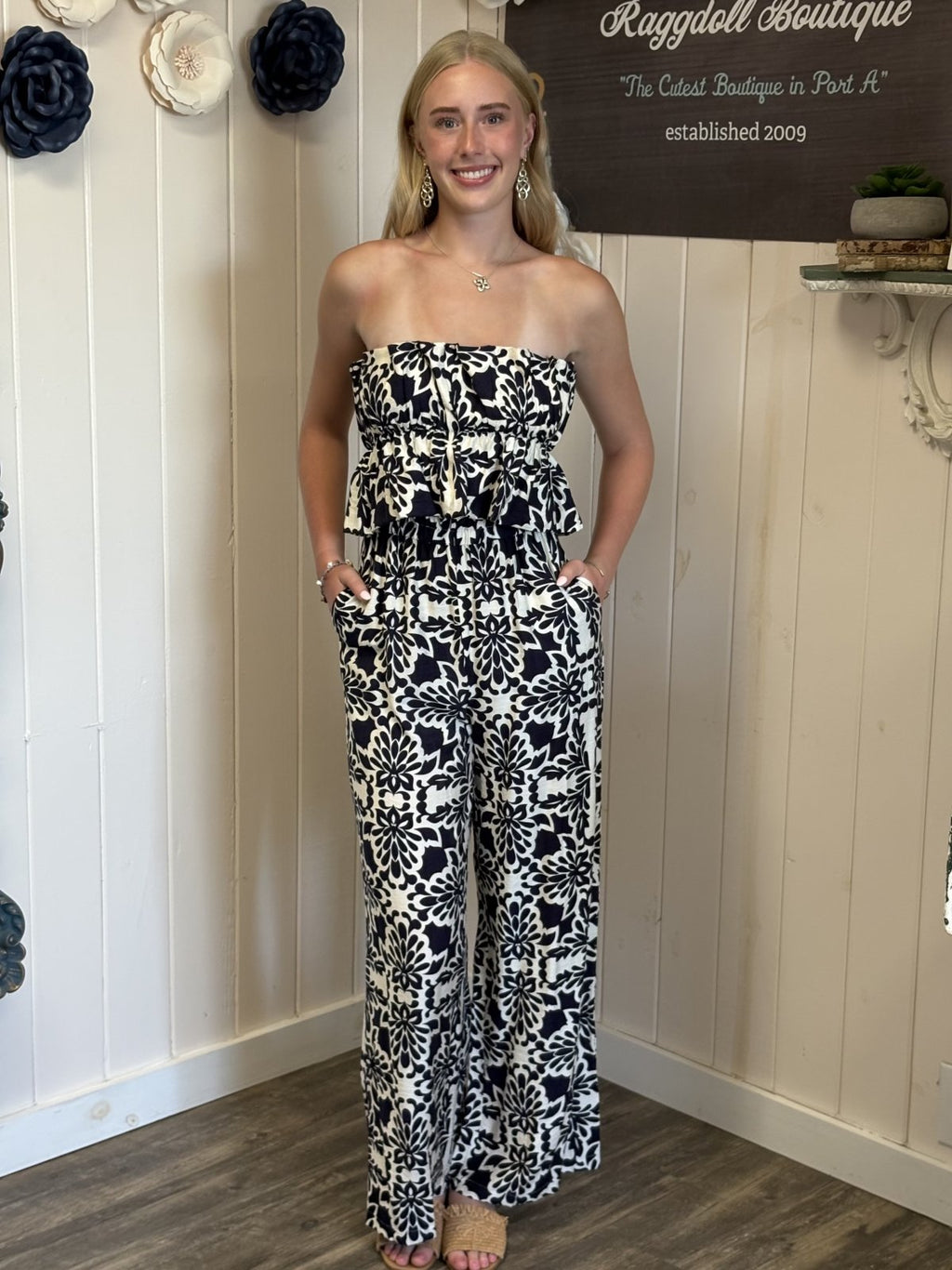 Navy and ivory strapless jumpsuit from coastal boutique clothing, perfect for beach outings and tropical vacations.