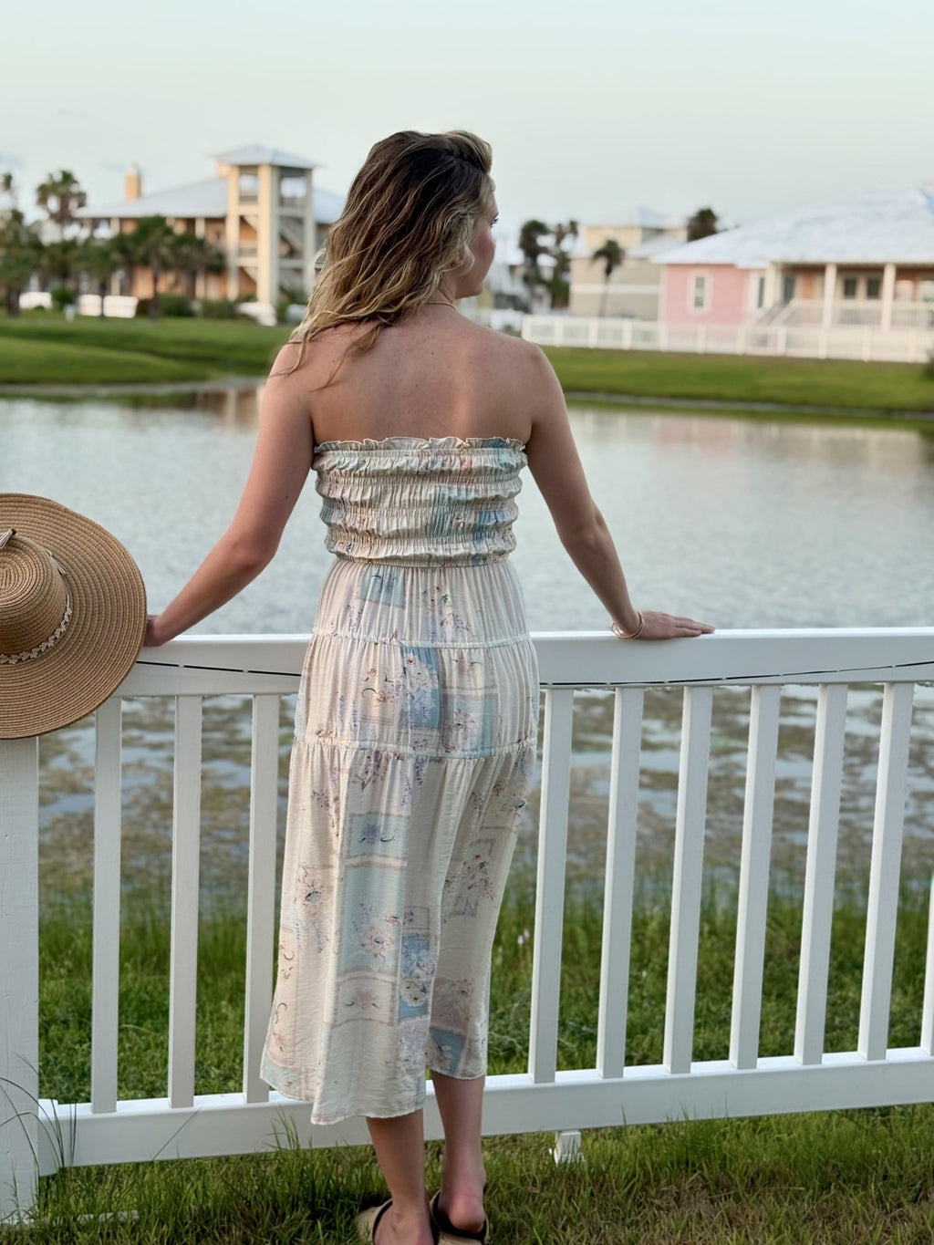 Mollie Dress showcasing a model by the water in a coastal setting, perfect for summer outfits Texas from Raggdoll Boutique.