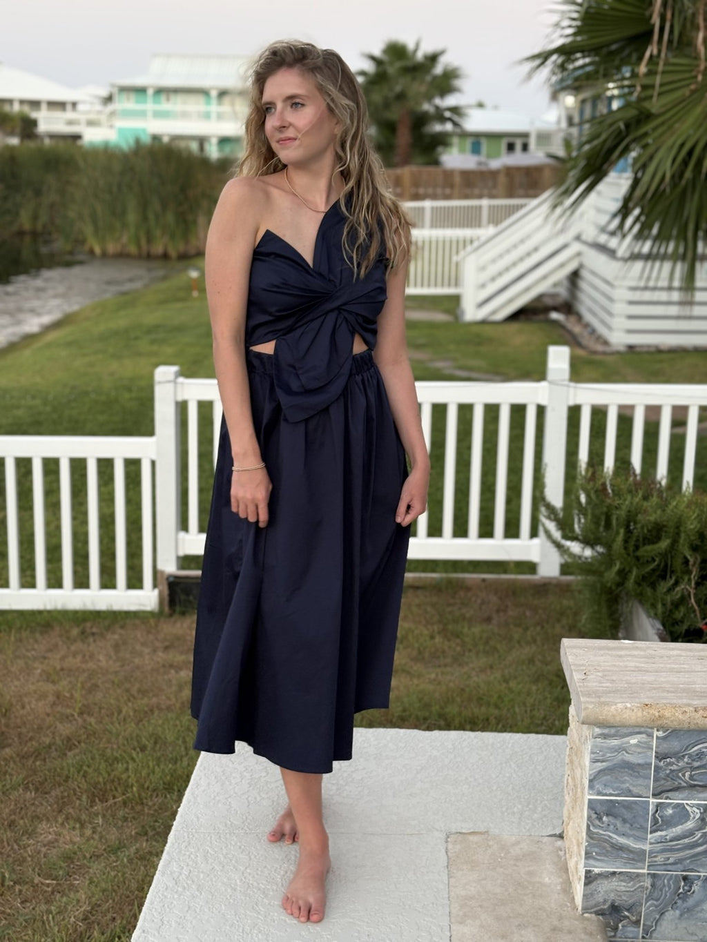 Navy Knot Twisted Midi Dress from a Port Aransas boutique, perfect beach dress for tropical vacations and curvy fashion.