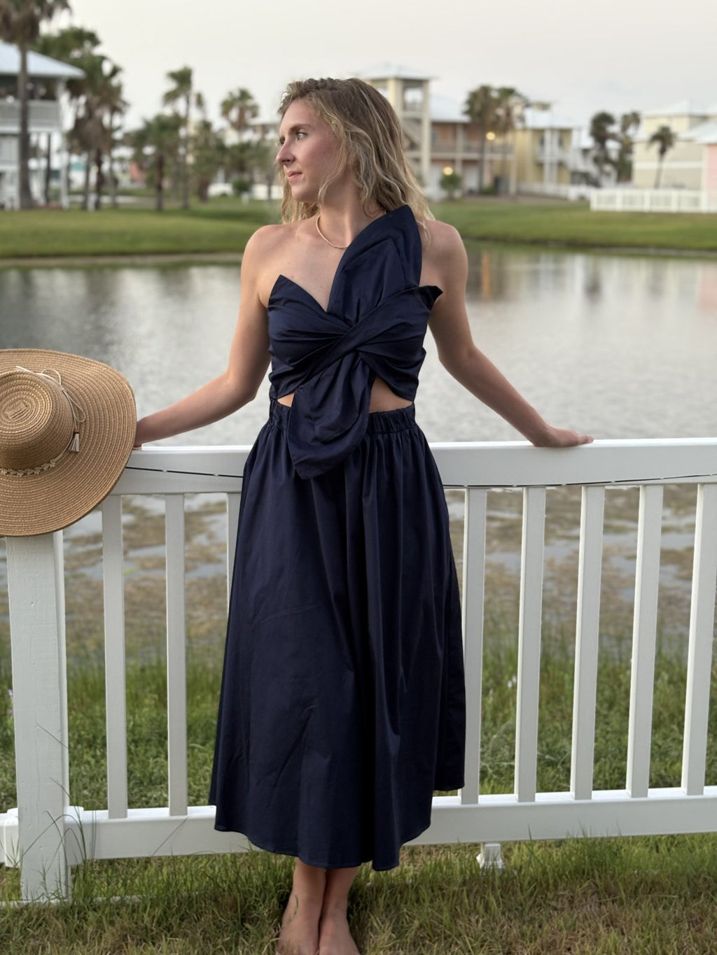 Stylish Navy Knot Twisted Midi Dress at a coastal boutique, perfect for tropical vacations and curvy plus size fashion.