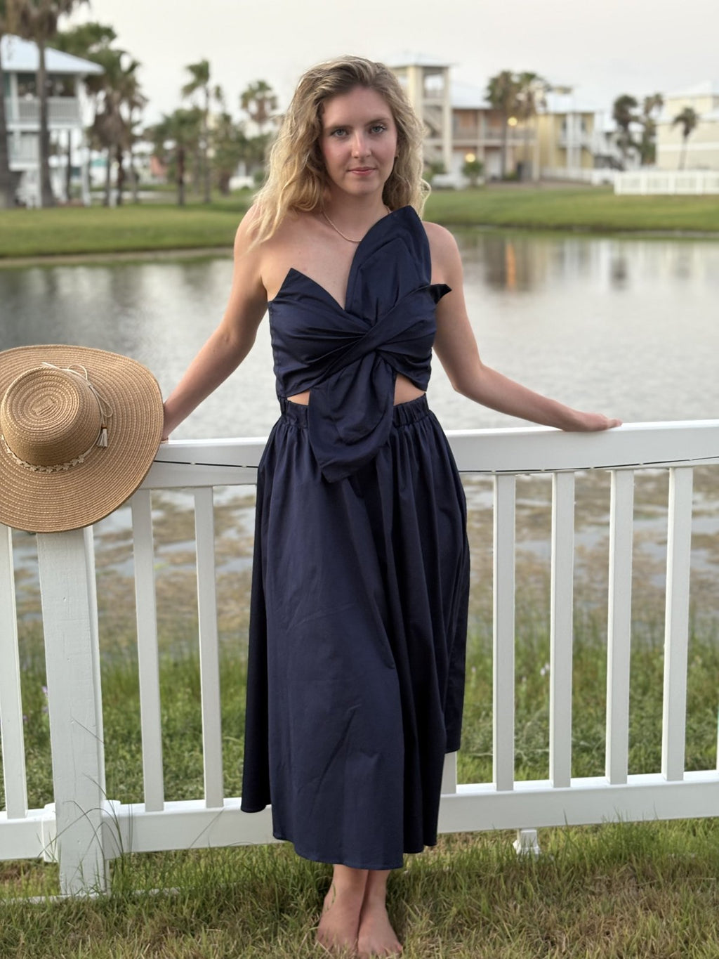 Navy Knot Twisted Midi Dress from coastal boutique clothing, ideal for stylish beach outings and tropical vacations.
