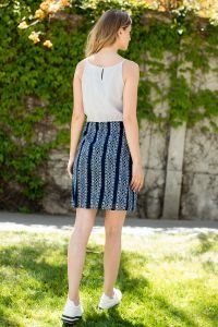 Back view of a stylish stripes and prints THML dress, ideal for coastal boutique clothing and tropical vacation outfits.