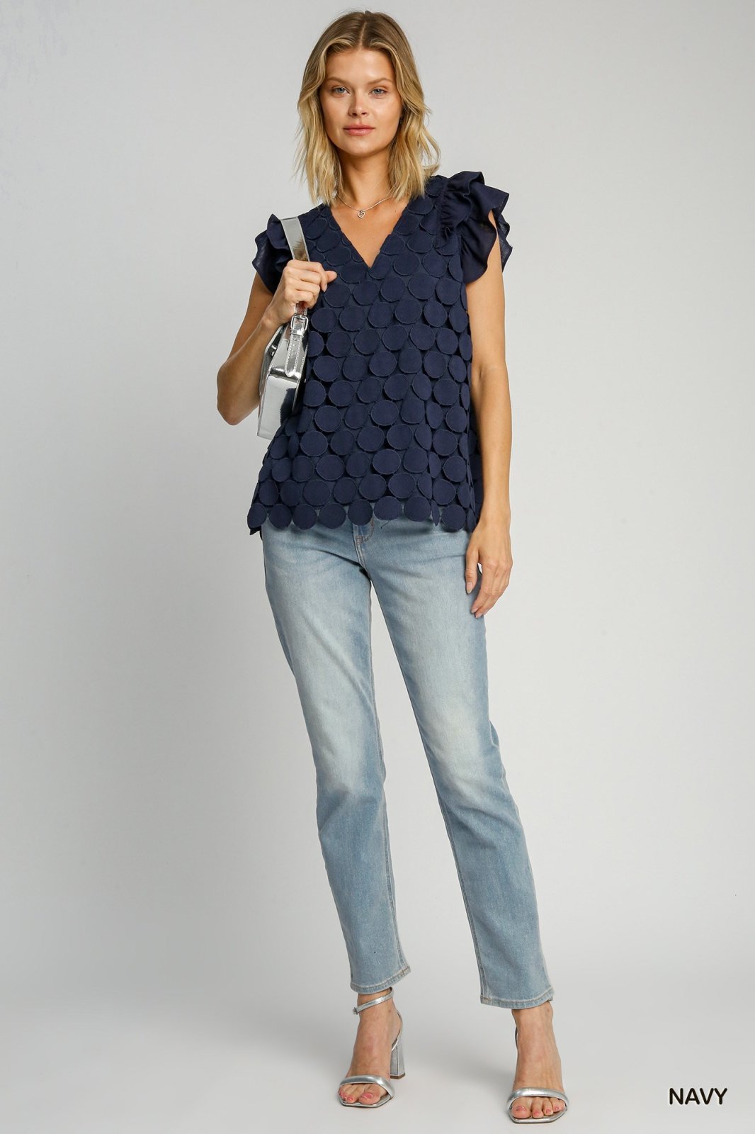 Model wearing the Elizabeth Top in navy, perfect for trendy coastal style and summer outfits Texas.
