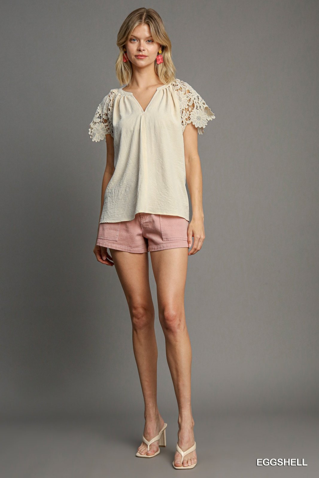 Lanie Top from Raggdoll Boutique, a trendy coastal style women's top, paired with shorts for summer outfits Texas.