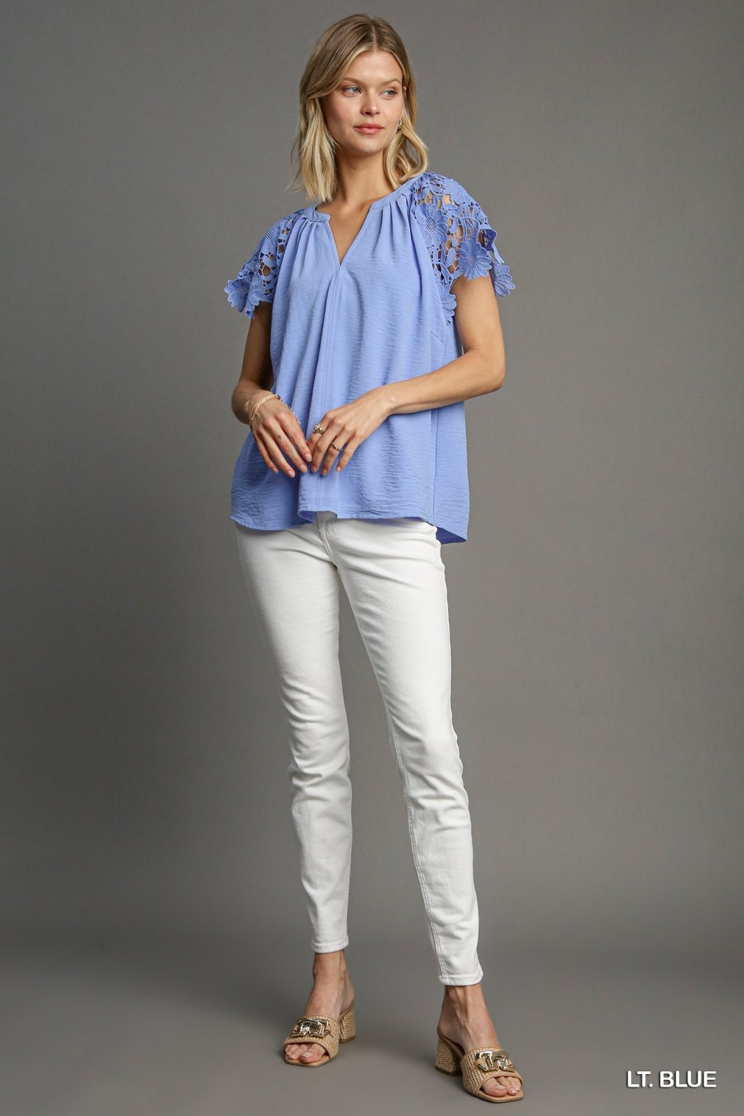 Megan Top in light blue, stylishly worn with white pants, perfect for summer outfits Texas from Raggdoll Boutique.