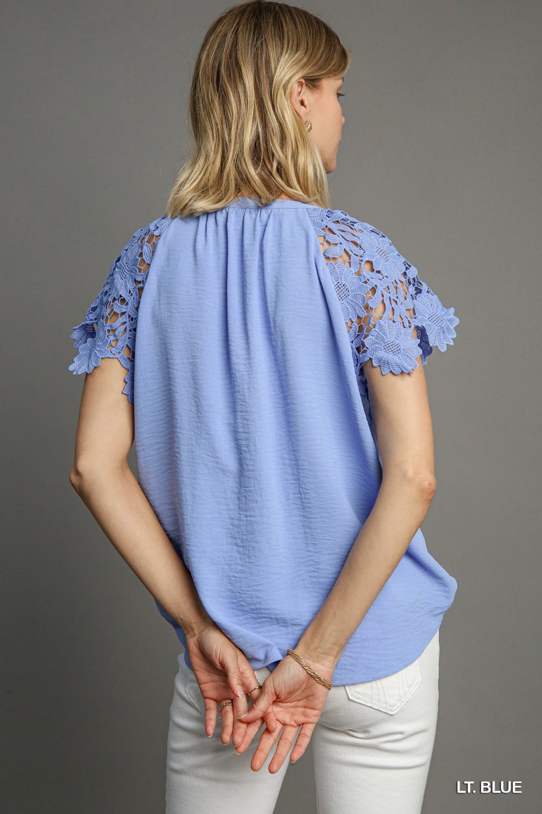 Megan Top in light blue featuring lace sleeves, available at Raggdoll Boutique, trendy coastal fashion boutique.
