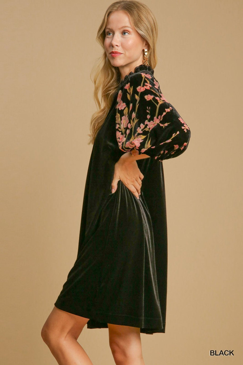 Floral sleeve black velvet dress, perfect for tropical vacations. Shop at Port Aransas boutique for curated women's fashion.