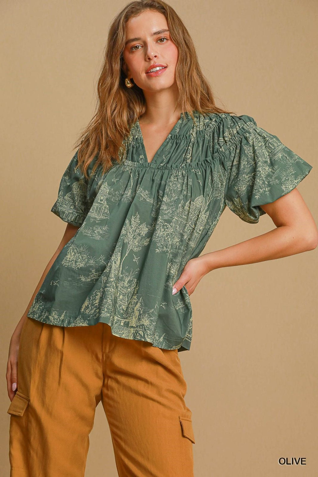 Olive cotton top featured at coastal boutique, perfect for tropical vacations and stylish women's fashion in Port Aransas.