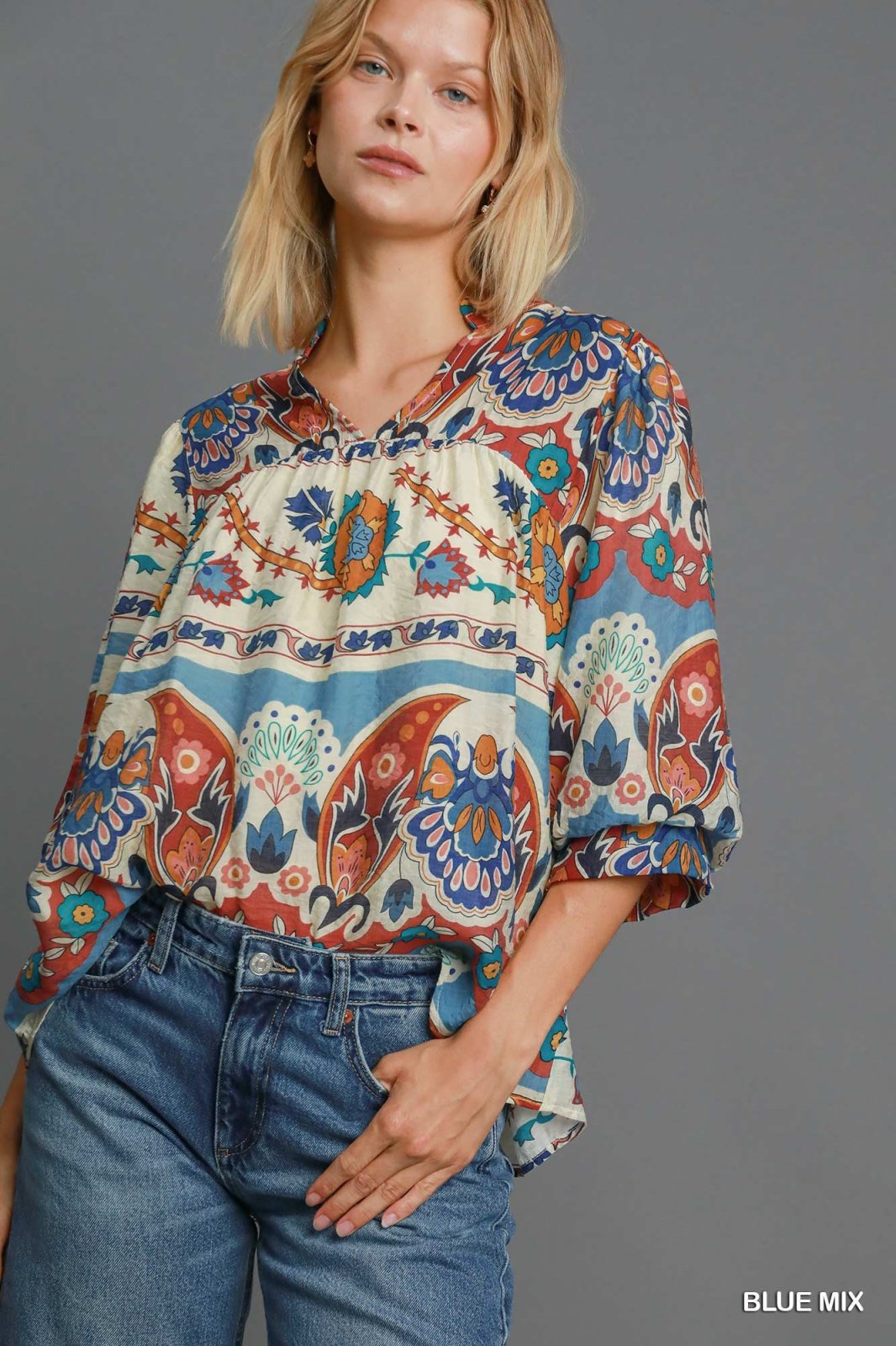 Stylish fall top with colorful floral patterns, perfect for curvy plus size fashion from a coastal boutique.