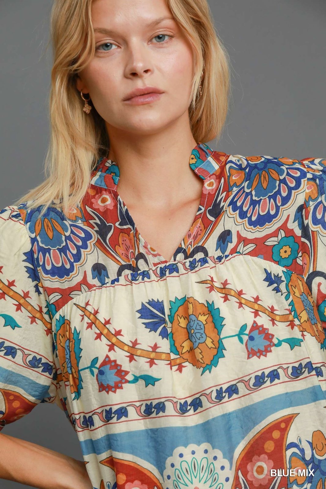 Stylish Perfect Fall Top featuring vibrant floral patterns, perfect for curvy women, available at a Port Aransas coastal boutique.