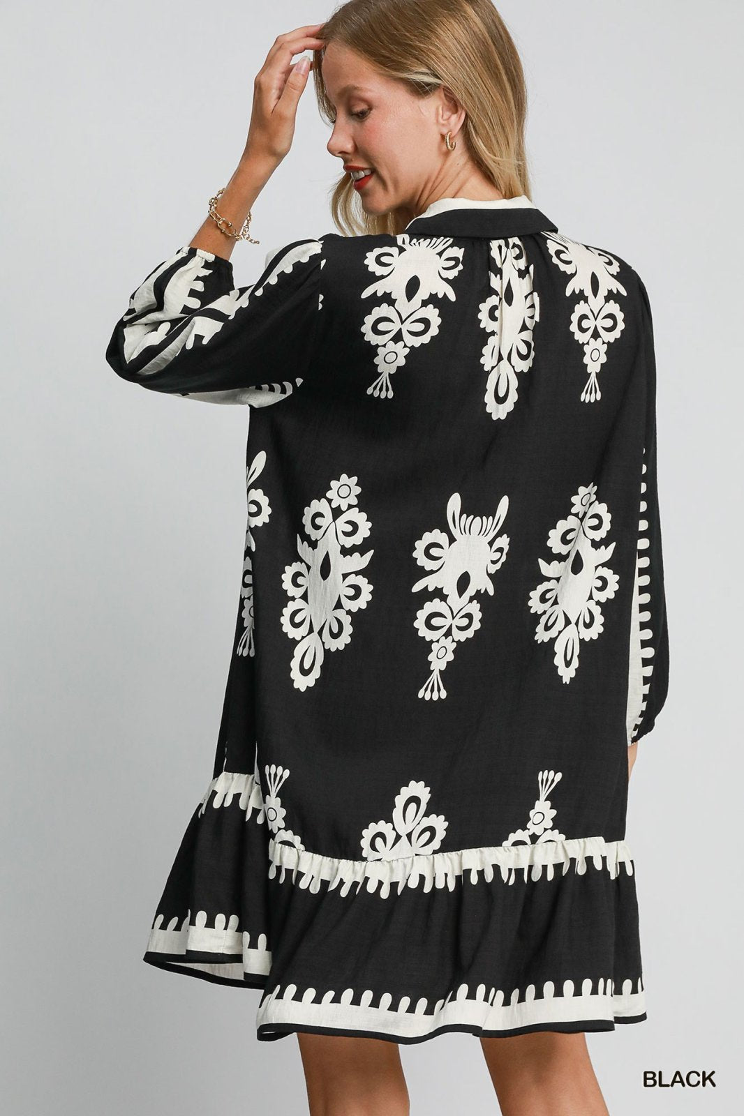 Melinda Dress in black, featuring intricate patterns, perfect for beach dresses and stylish tops at Port Aransas boutique.