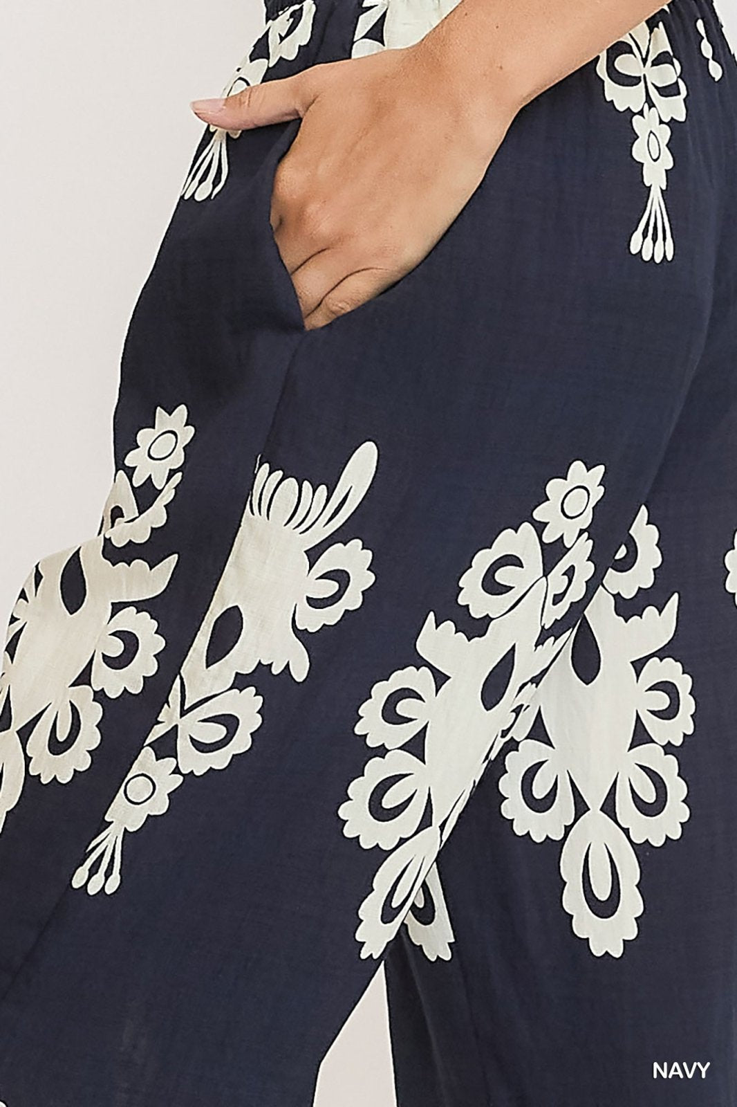 Navy border print pants with pocket detail, perfect for coastal boutique clothing and Port Aransas summer style.