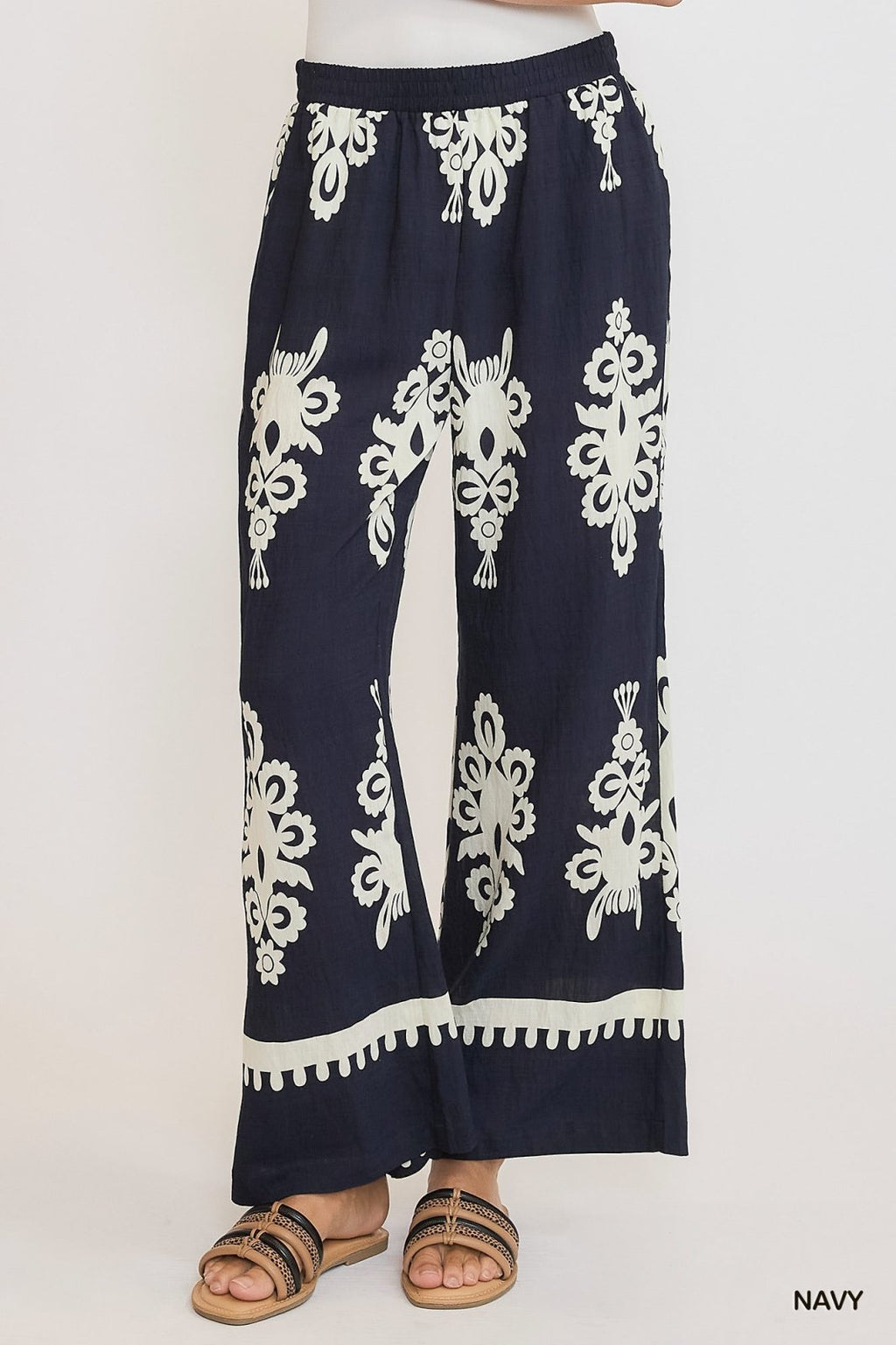 Navy and cream border print pants with elastic waistband, perfect for coastal boutique clothing and stylish women's bottoms.