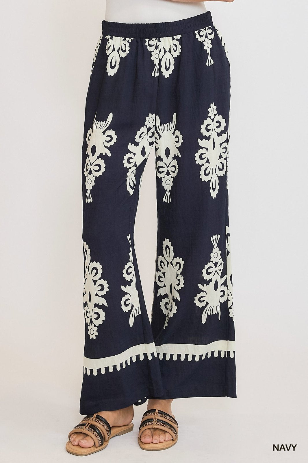 Navy and cream border print pants with elastic waistband, perfect for coastal boutique clothing and stylish women's bottoms.