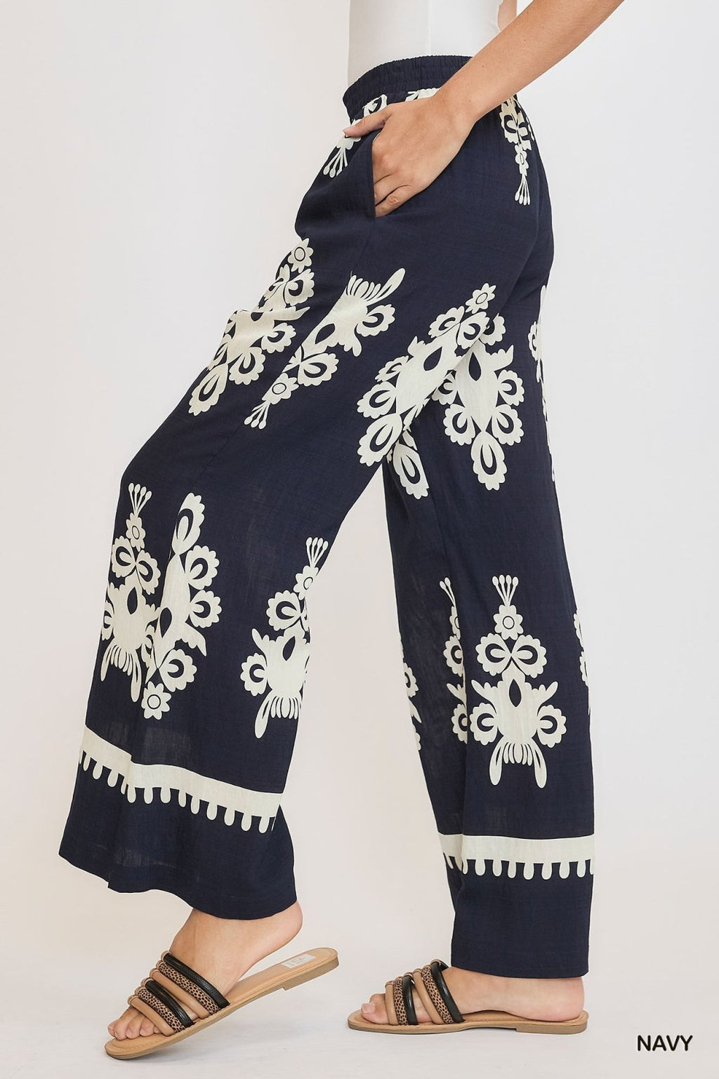 Navy and cream border print pants with elastic waistband, perfect for coastal boutique clothing and stylish women's bottoms.