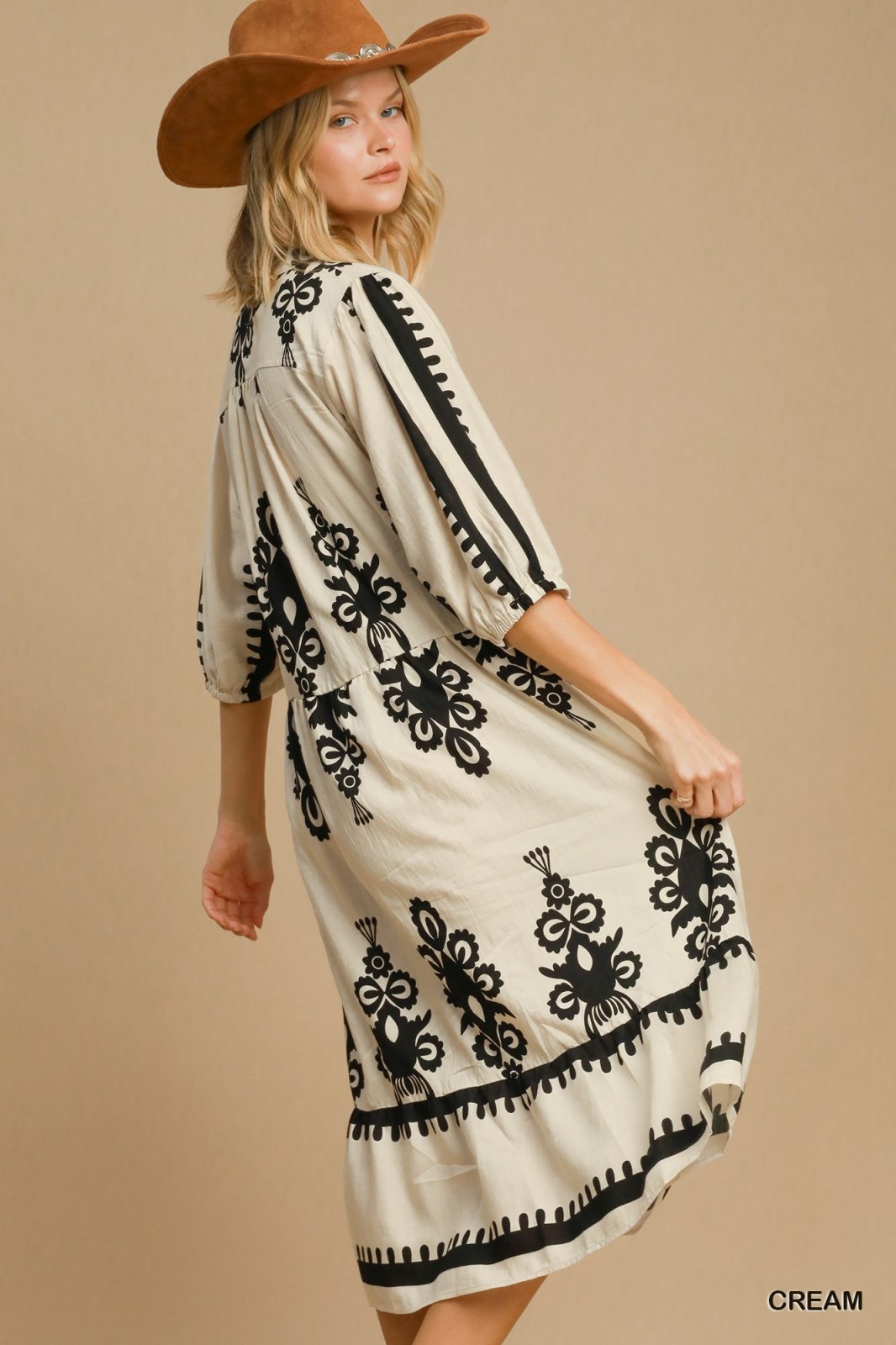 Stylish cream midi dress with black detailing, perfect for beach vibes and curated women's fashion from Port Aransas boutique.