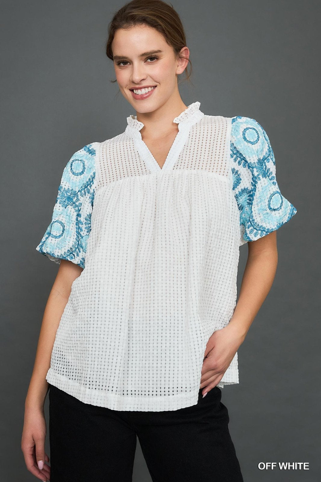 Eleanor Top from a coastal boutique featuring checkered seersucker design, perfect for tropical vacations and stylish casual wear.