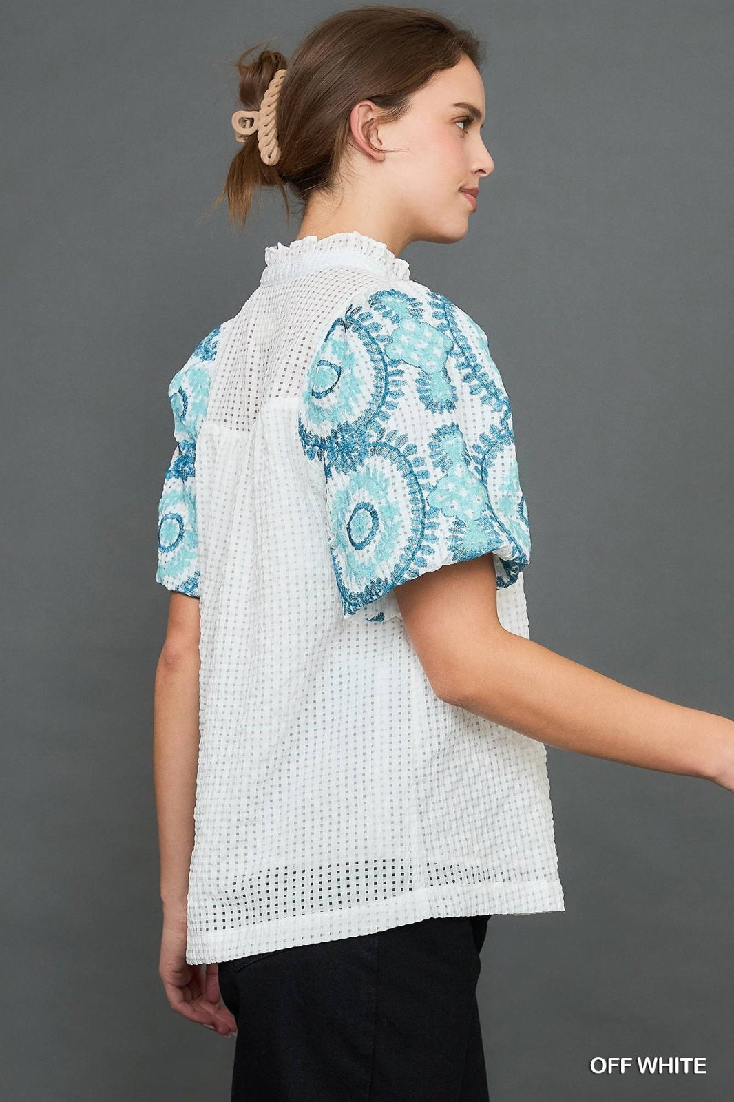 Eleanor Top from a coastal boutique, featuring a stylish checkered seersucker design perfect for tropical vacations.
