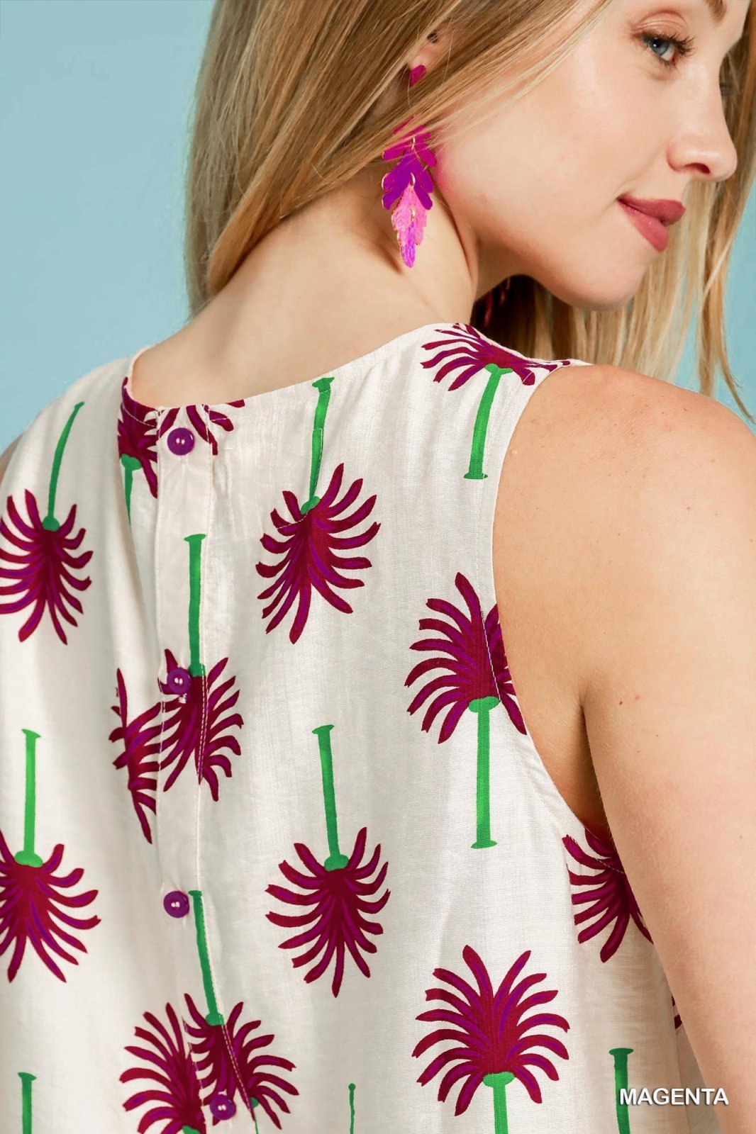 Magenta palm print sleeveless top from coastal boutique clothing, perfect for tropical vacations and summer outfits.