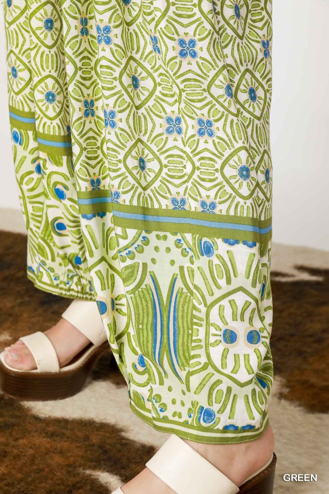 Abstract green mixed print palazzo pants for women, ideal for coastal boutique clothing and tropical vacation styles.