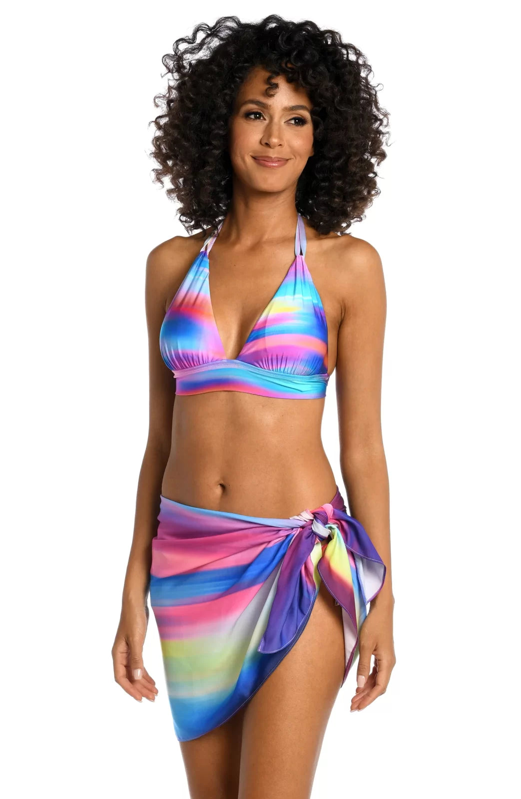 Model wearing SUNSET SHORT PAREO WRAP with a colorful bikini top, showcasing trendy coastal style from Raggdoll Boutique.