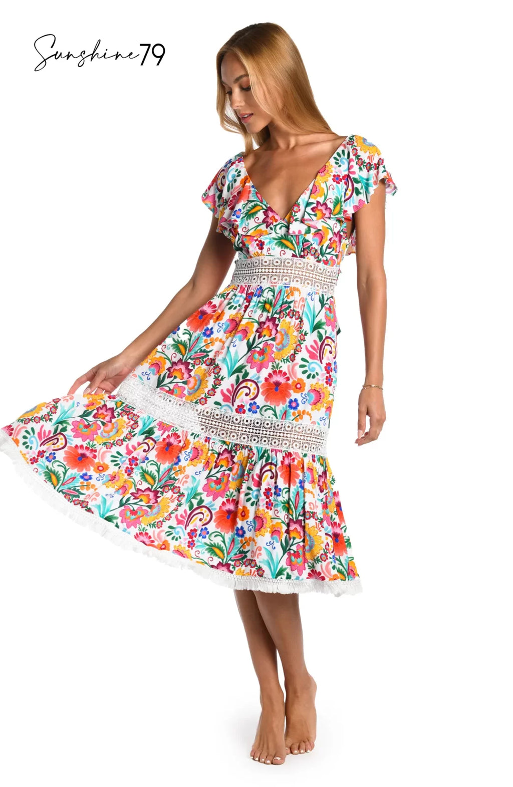BONITA MIDI DRESS from Raggdoll Boutique showcases vibrant Spanish-inspired print and flounce sleeves, ideal for coastal fashion.