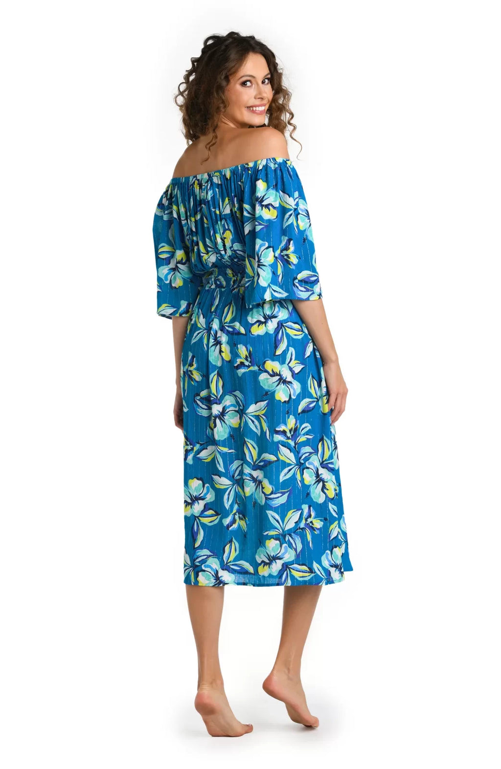 Model in a floral off-the-shoulder cover-up dress, perfect for tropical vacations, from a Port Aransas boutique.