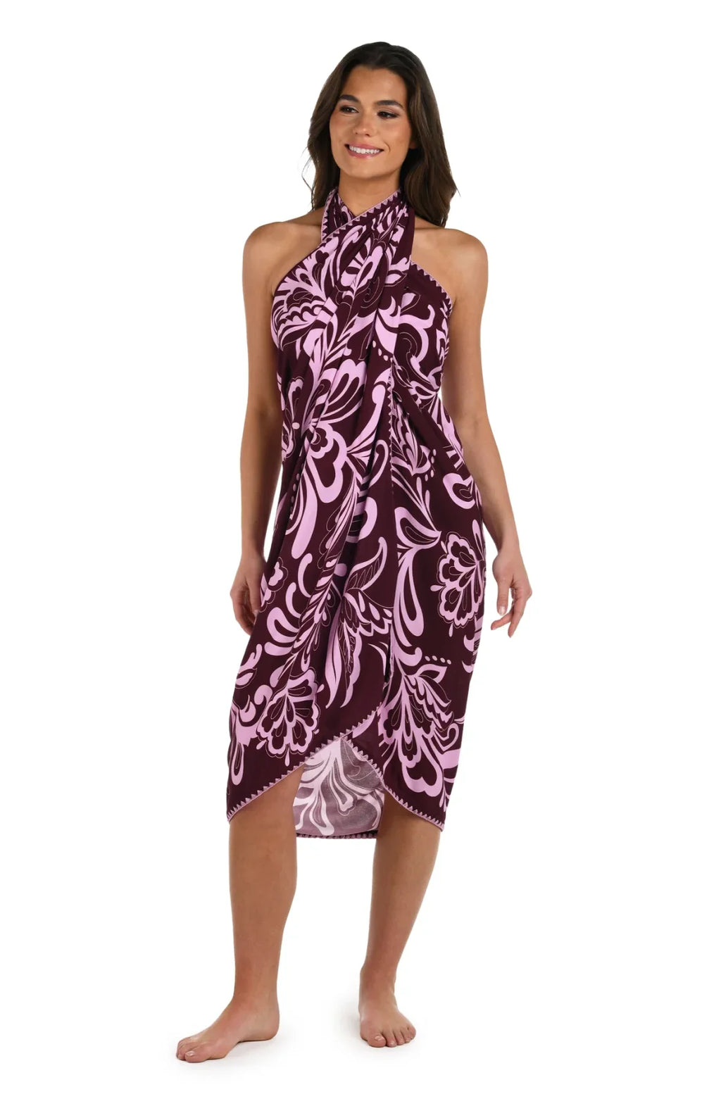 Fiji Floral Pareo Cover-Up showcasing large burgundy and pink floral motifs, perfect for stylish beachwear at a coastal boutique.