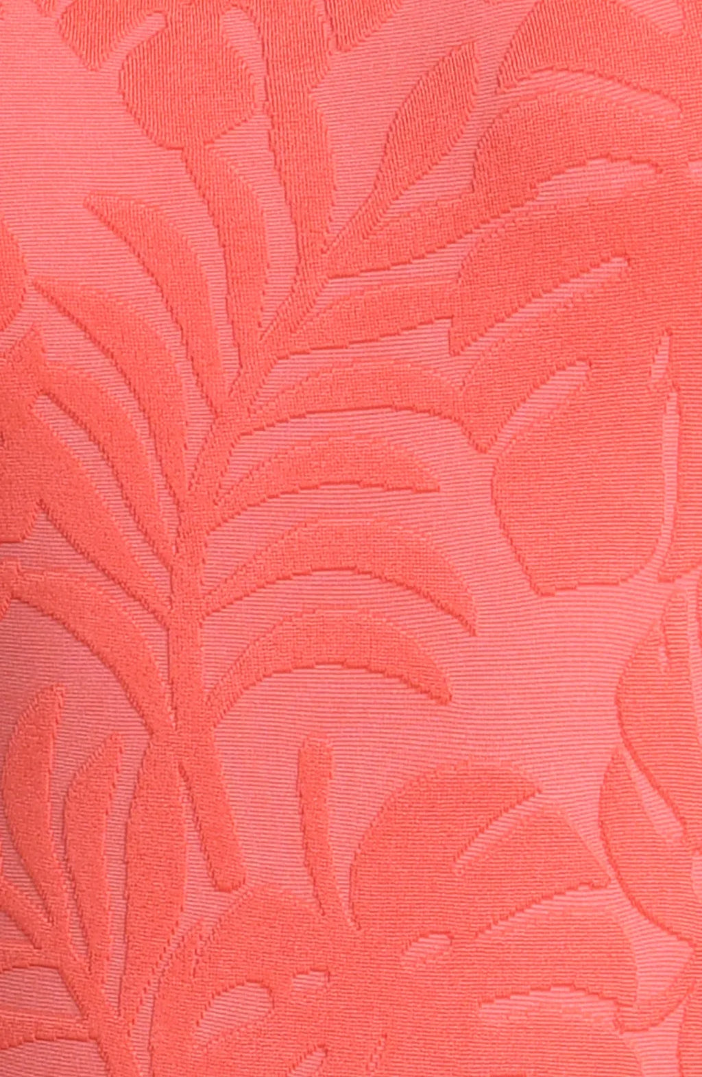 Close-up of coral fabric featuring palm leaf pattern for LA BLANCA ISLAND PALM BANDED HALTER TOP SWIMWEAR.
