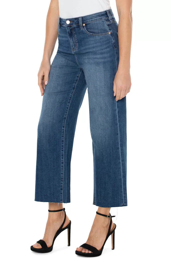 LP Stride Hi-Rise Crop Wide Leg Jeans worn with stylish heels, perfect for vacation wardrobe boutique at Raggdoll Boutique.