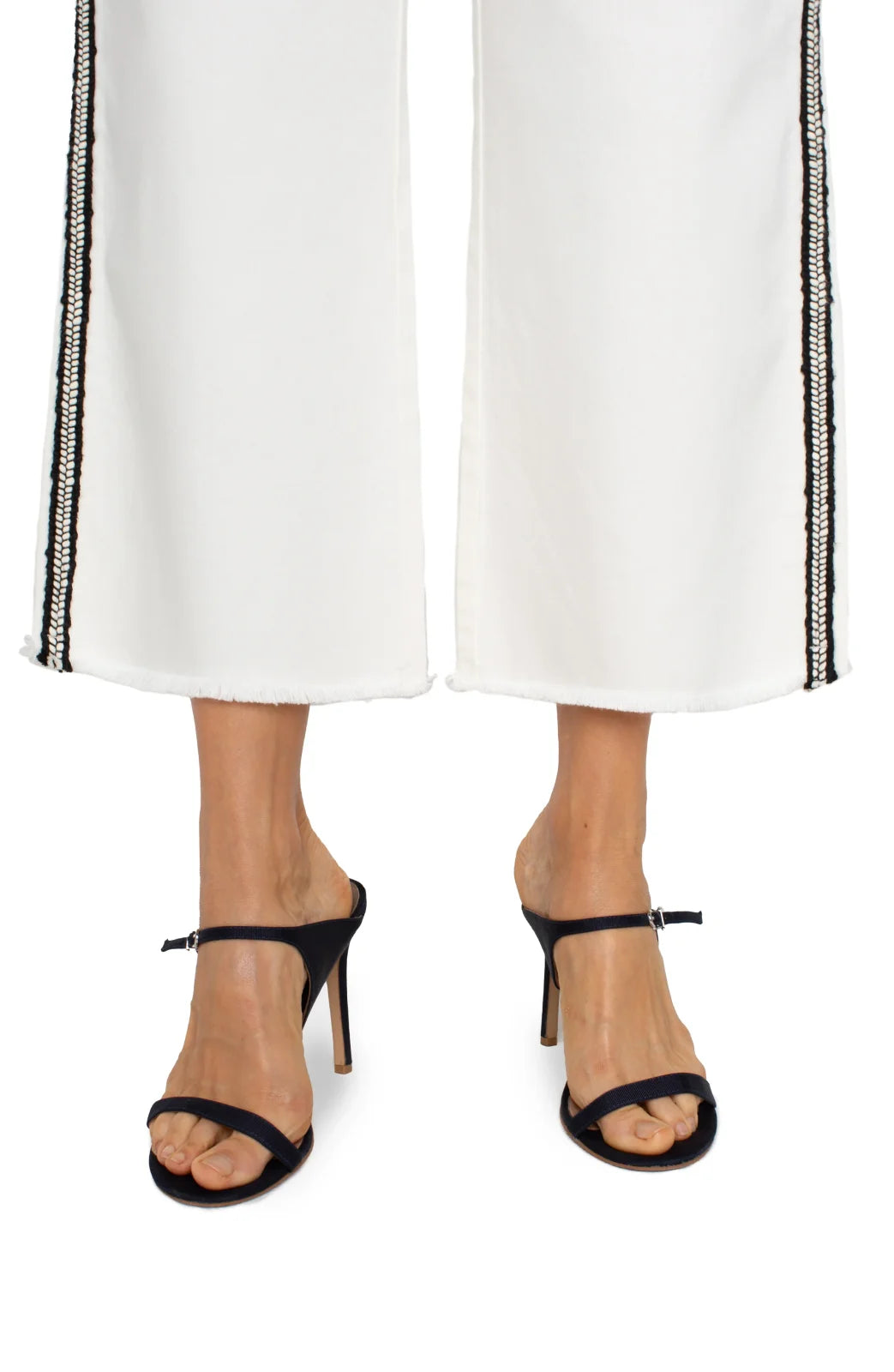 Stylish LP Stride high-rise crop in bright white paired with black heels, ideal for coastal boutique clothing and curvy women's fashion.