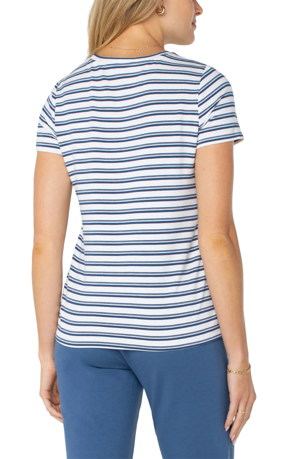 Back view of a woman in a Liverpool Classic Crew Neck Tee, ideal for coastal boutique clothing and beach styles.