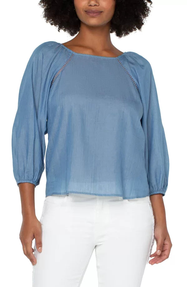 LIVERPOOL LIGHT CHAMBRAY TOP showcasing a square neck and puff sleeves, perfect for trendy coastal style from Raggdoll Boutique.