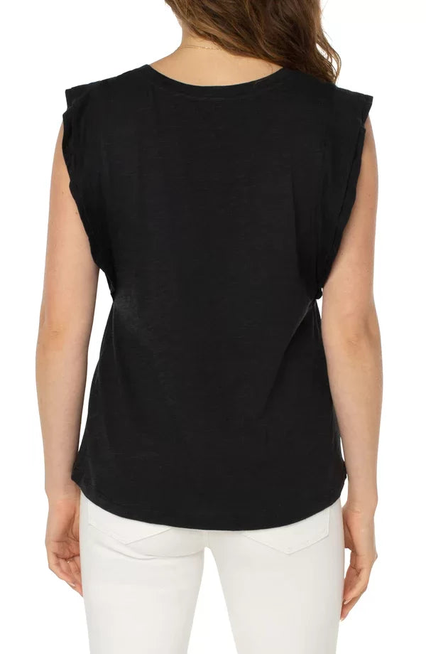View of back of LIVERPOOL BLACK FLUTTER SLEEVE SLUBKNIT TEE worn with white jeans, showcasing a trendy coastal style.