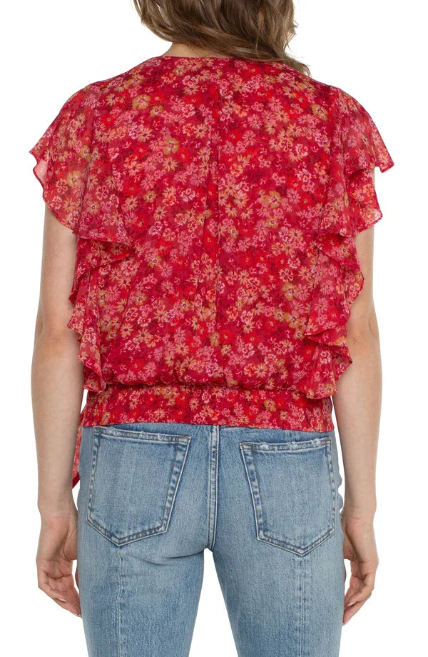 Liverpool Berry Balsam Waist -Tie Top back view, featuring floral print and ruffle sleeves, styled with denim.