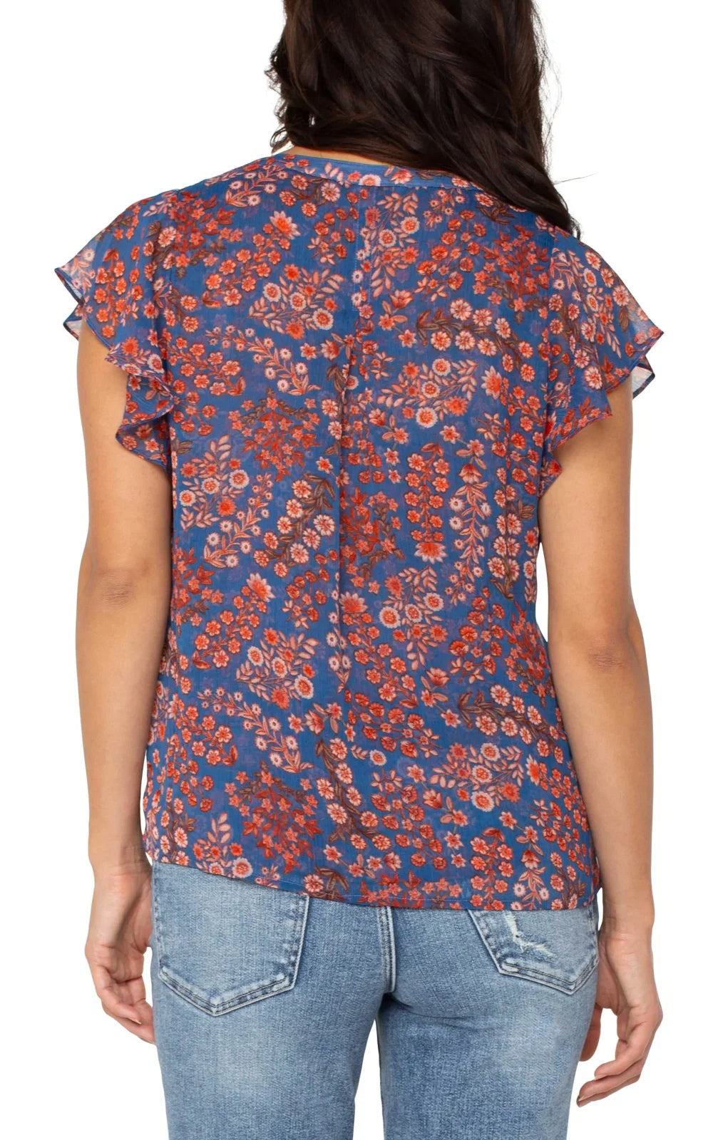 Back view of Liverpool blue/pink flutter sleeve top for coastal boutique clothing, perfect for beach outfits and vacations.
