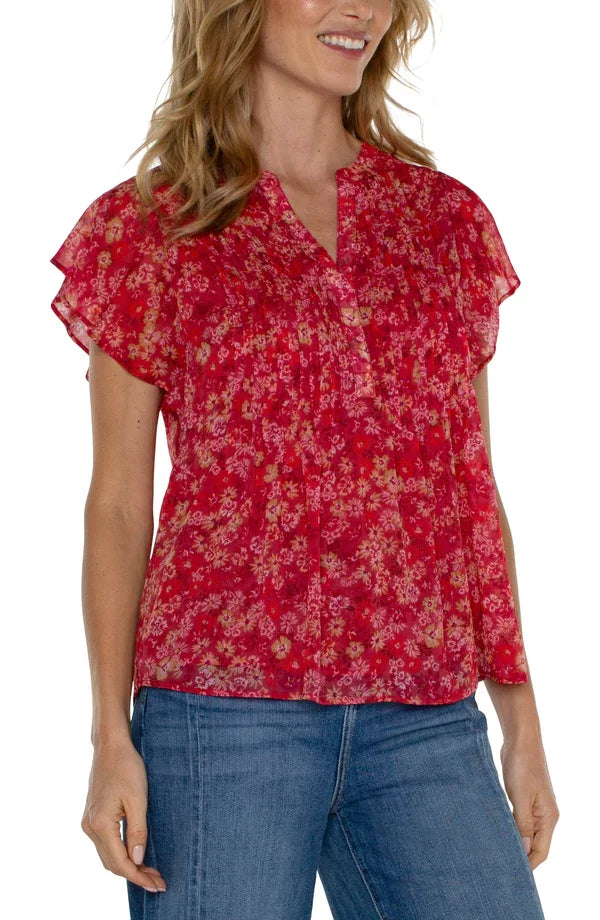Liverpool Berry Blossom Flutter Sleeve Top(Petite) styled with denim for a trendy coastal look, available at Raggdoll Boutique.
