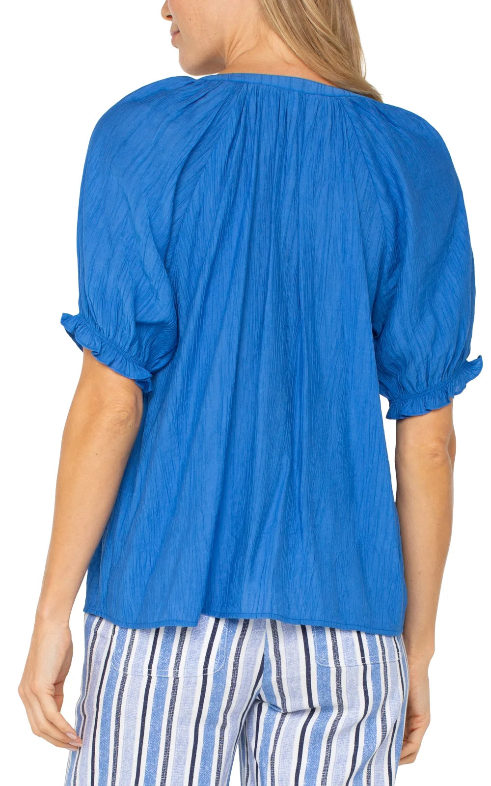 Back view of LP Cobalt Blue Short Sleeve Blouse with puff sleeves, perfect for coastal boutique clothing and warm weather.