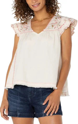 LP embroidered top with cut-out details, flutter sleeves, fabric blend - perfect for coastal boutique clothing and summer style.