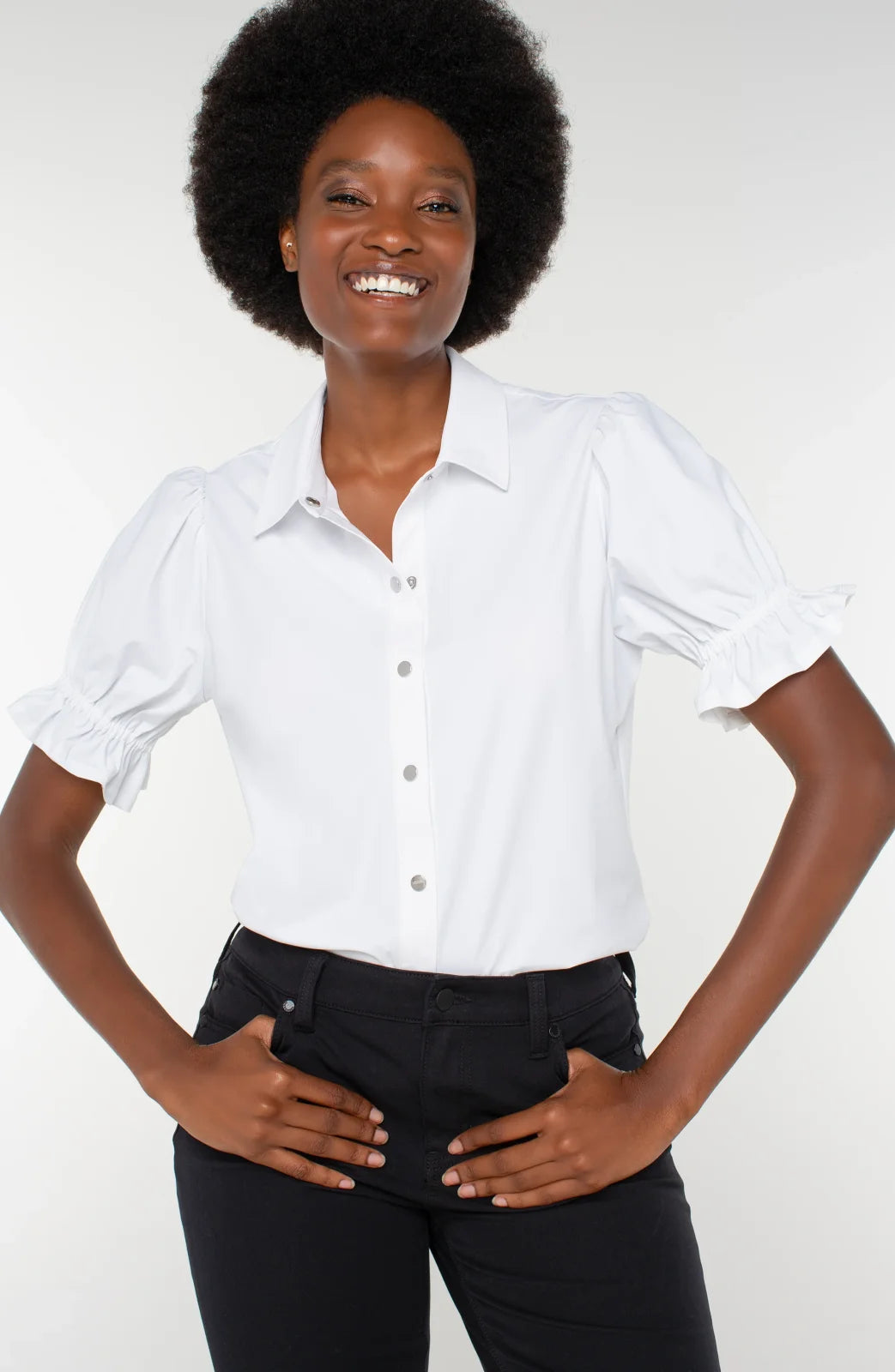 Model wearing LP Snap Front Knit Shirt in white, showcasing puffed sleeves for stylish coastal boutique clothing.
