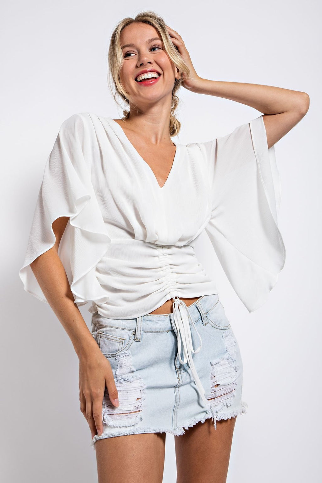 OFF-WHITE TOP WITH RUCHED DETAIL styled with a denim skirt for trendy coastal style, from Raggdoll Boutique.