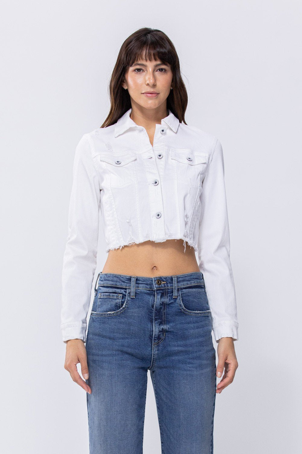 WHITE CROP SLIGHT DISTRESS JACKET worn with denim jeans, from Raggdoll Boutique, a coastal fashion boutique in Port Aransas.