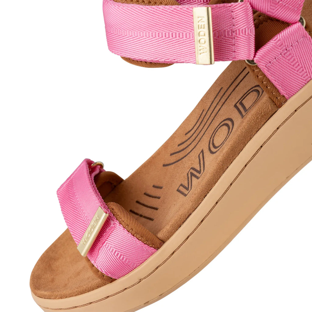 Woden Aurora Pink Sandals featuring adjustable straps and soft materials, perfect for coastal boutique clothing and tropical vacations.